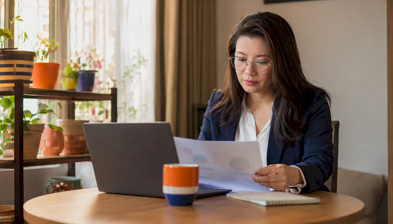 Professional woman analyzing data dashboards