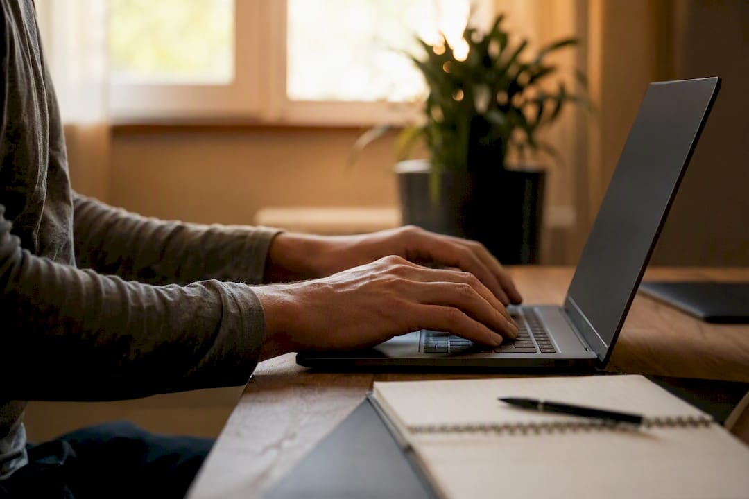Hands typing review removal appeal on laptop